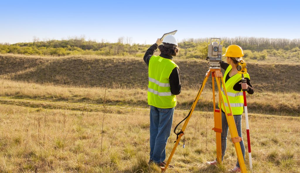 Two land surveyors from North West Land Surveyor confirming there is no encroachment into another title in Melbourne